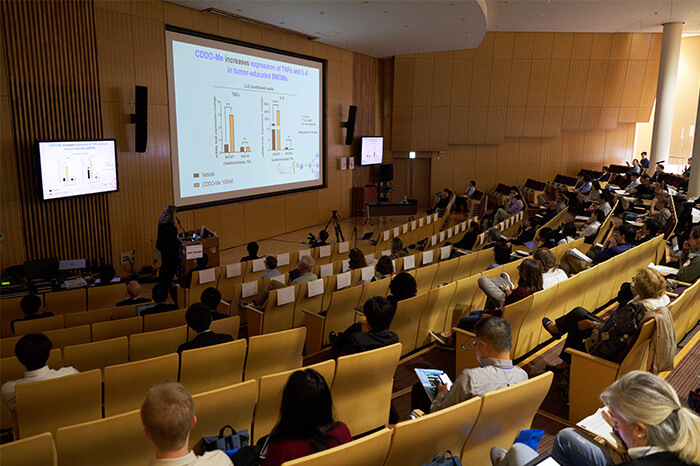 Attendees joining in a seminar at the University's lecture hall